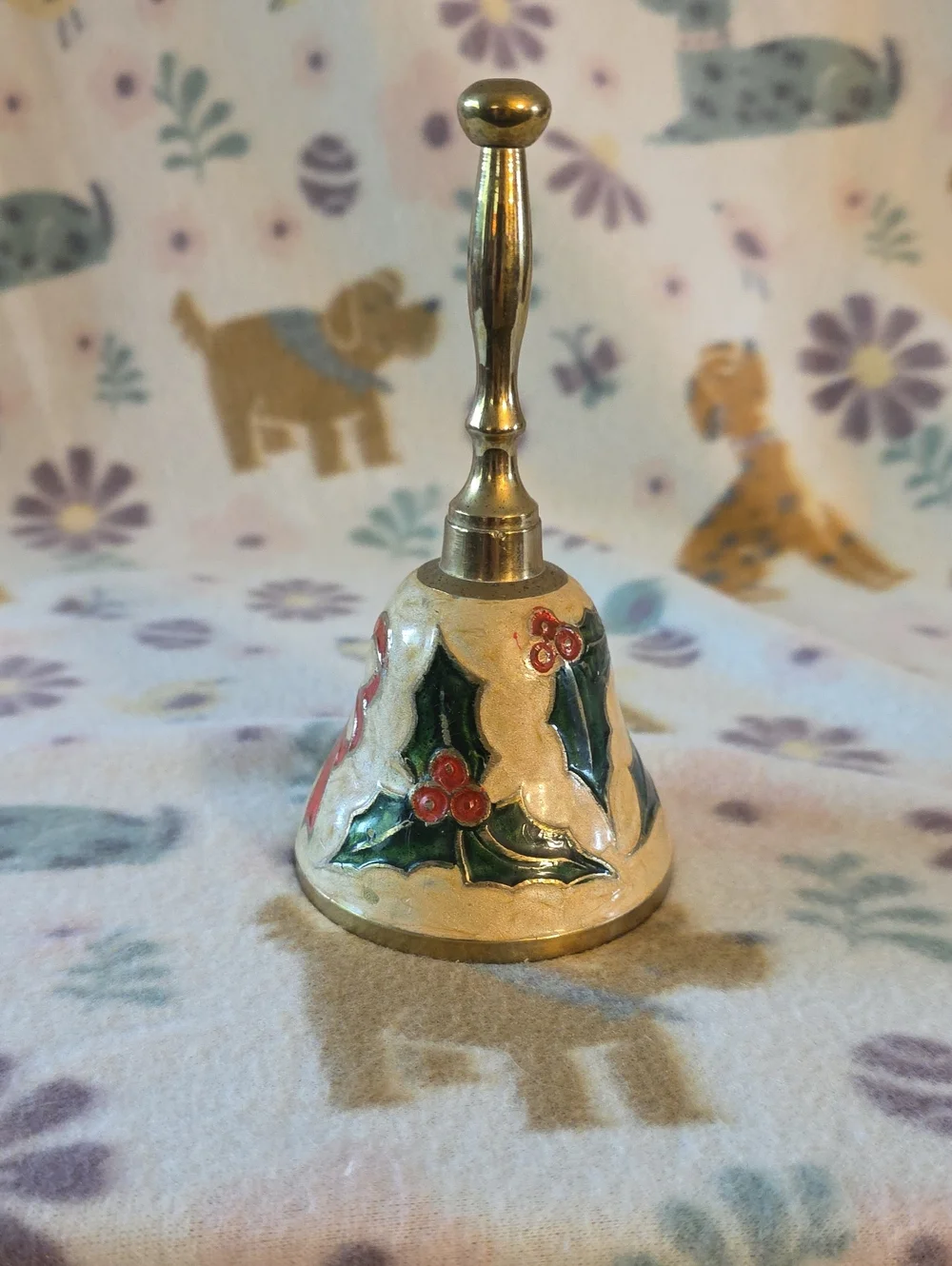 vintage brass bell featuring enameled holly leaves and berries